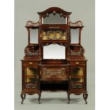 A late Victorian cherrywood display cabinet, in two sections,