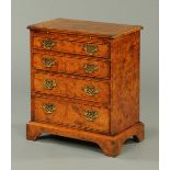 A George II style walnut chest of drawers, reproduction,