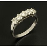 An 18 ct white gold five stone ring, set with diamonds weighing 1.02 carats, size N.