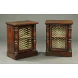 A pair of mahogany pedestal cupboards, with brass grilles,