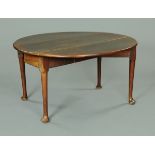 An 18th century drop leaf mahogany breakfast table, with pad feet.  143 cm diameter.