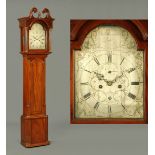 A George III mahogany cased longcase clock, with swans neck pediment above the arched glazed door