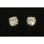 A pair of 18 ct white gold screw back stud earrings, diamond weight .48 carats.