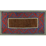 * A floor felt, probably Georgia, brown rectangular centre panel, red and blue repeating border.