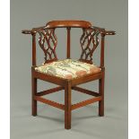 A George III mahogany corner armchair, with pierced splat back,