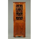 A 19th century inlaid mahogany standing corner cupboard, with glazed upper section,