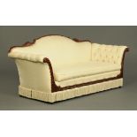 A mahogany framed settee, with rope twist and foliate carved top rail, with deep buttoned arms,