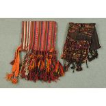 * Two Afghan saddle bags, multicoloured, each with fringe.  Smallest 42 cm x 123 cm.