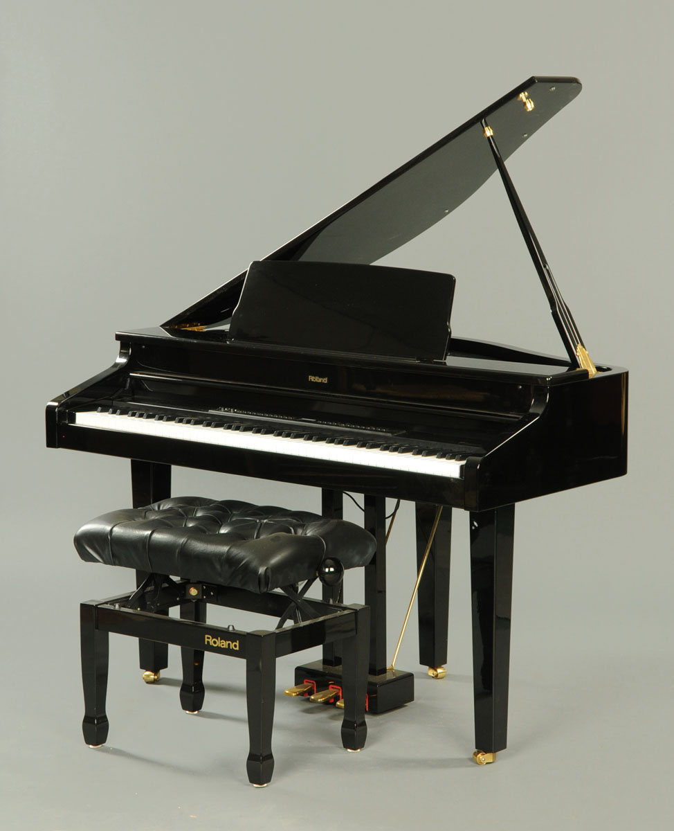 A Roland HP-11 digital baby grand piano, in piano black with matching adjustable music seat.