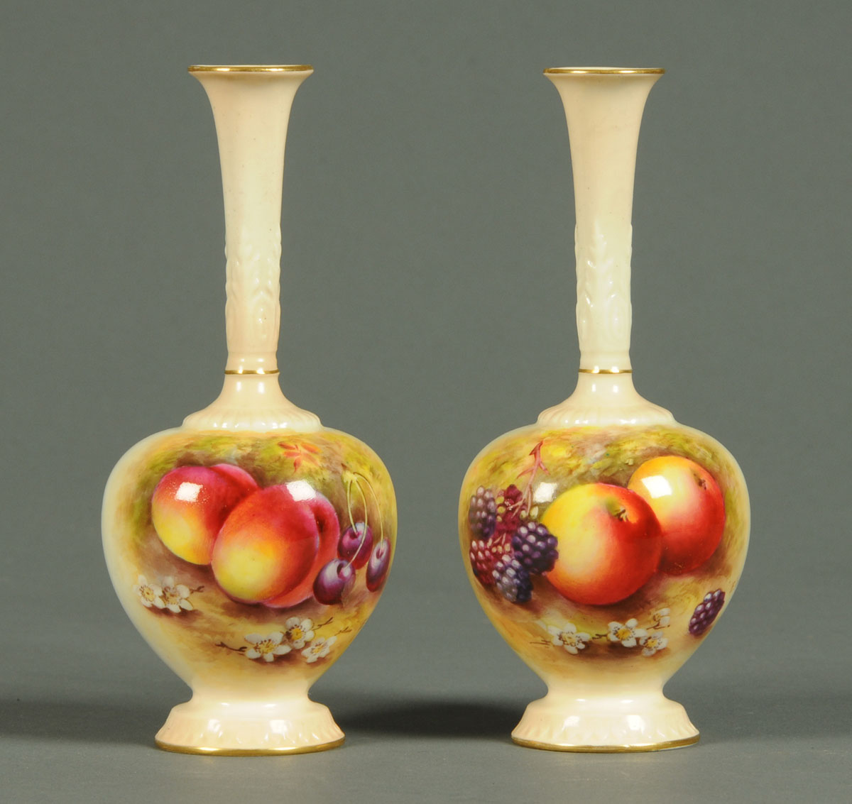 A pair of Royal Worcester vases, handpainted with autumn fruits by E. Townsend, puce mark to
