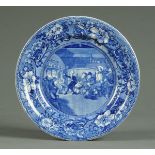 * A 19th century blue and white transfer printed plate, "Doctor Syntax Reading".  Diameter 26.5 cm.