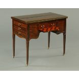 An Edwardian mahogany turnover top games table, with Registration No.