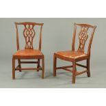 A pair of Edwardian mahogany Chippendale style side chairs, each with drop in seat,