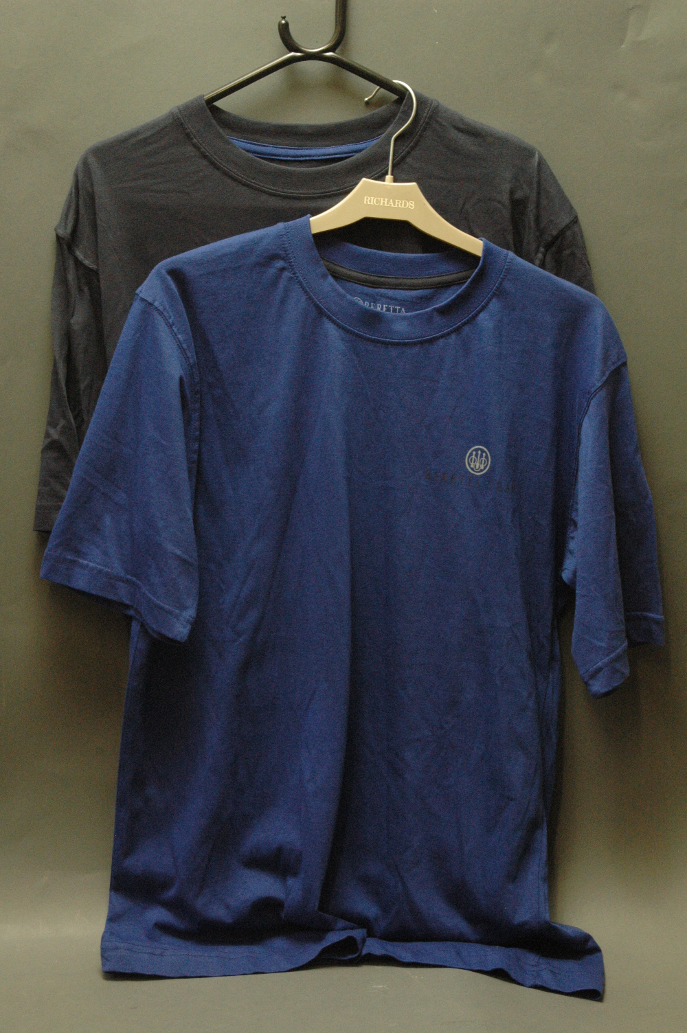 Two Beretta T shirts, pale blue and dark blue, (M) new.