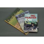 Three books on working dogs, including "Diary of a Pig Hunter" by Reg Carr.