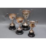 Four silver plated trophies, no engraving.