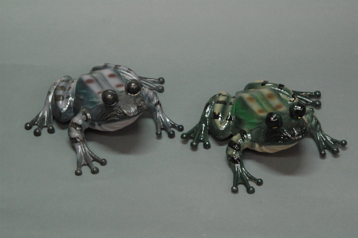 Two large plastic frogs.  Length 22 cm.