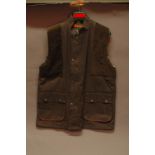 Barbour Gamefair waxed jacket (91 cm), Sherwood waxed body warmer (L) and pair of waxed chaps.