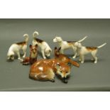 Four Beswick First Version foxhounds, Beswick seated fox and two other foxes.