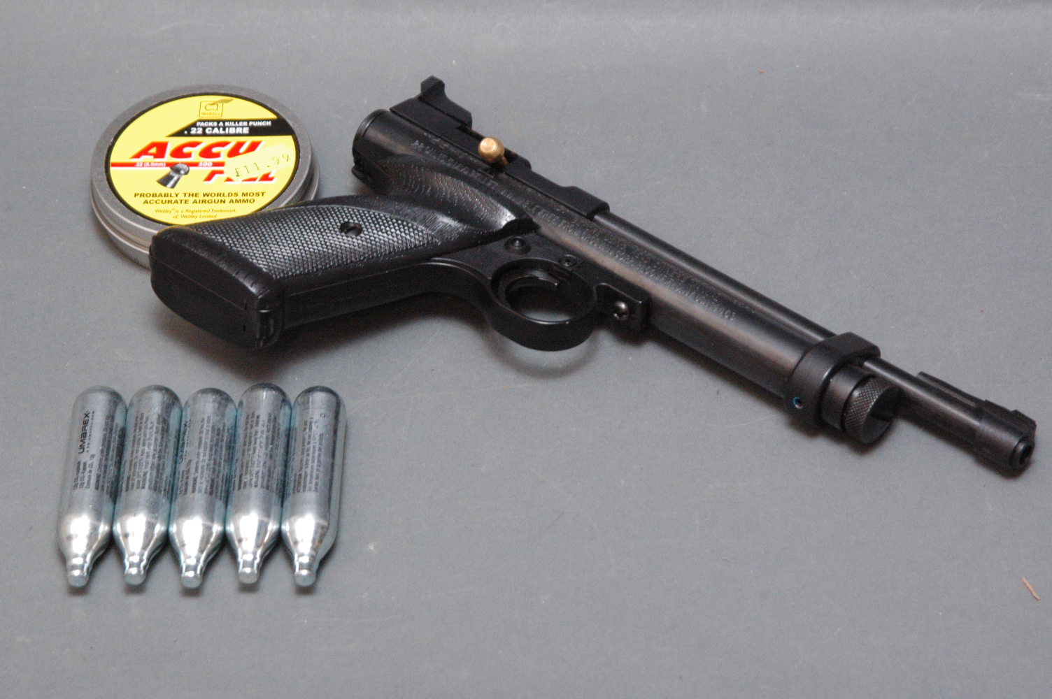 Crossman 2240 CO2 powered .22 air pistol, tin of pellets and five CO2 canisters.  Serial No.