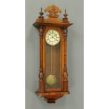 A Victorian walnut regulator wall clock, with two-train movement (no weights) and only one
