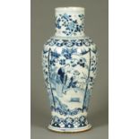 An early 19th century Chinese blue and white vase, decorated with figures, birds and flowers.