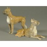 Two Royal Copenhagen dogs, one standing the other seated.  Each length approximately 16 cm.