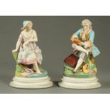 A pair of Edwardian bisque figures, seated artist and female companion.  Each height 30 cm.