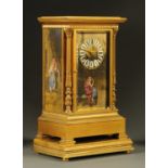 A late 19th century French gilt brass mantle clock, with porcelain panels depicting draped female