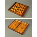 A 19th century combined chess and backgammon box, in a variety of specimen woods.