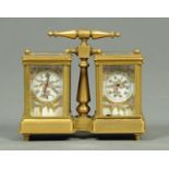 A brass combined clock and barometer set, with porcelain dials.  Height 11 cm, width 12 cm.