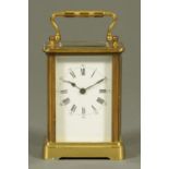An Edwardian brass carriage clock, timepiece only, with Roman numerals,