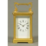 An Edwardian French brass carriage clock, with two-train striking movement, 1172 grams.  Height