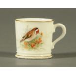 A Worcester coffee can, decorated in polychrome with a finch.  Height 4 cm.