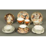 A collection of five tea cups and saucers, and a trio, including Royal Crown Derby.