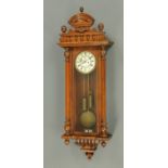A Gustav Becker Vienna regulator wall clock, walnut, twin weight, eight day striking.  Height 138