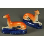 A pair of 19th century Staffordshire greyhound pen stands.  Length 16 cm.