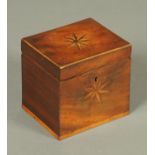A George III mahogany single compartment tea caddy, with starburst top and front panels.