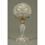 An Edwardian cut glass lamp, with mushroom shaped shade.  Overall height 38 cm.