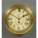 A 19th century brass cased ships clock, with single-train fusee movement, painted dial with Roman