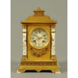 A porcelain and brass cased mantle clock, French, with two-train striking movement.