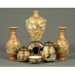 Three pieces of Satsuma teaware, a Satsuma vase and pair of Satsuma vases.  Tallest 27.5 cm.