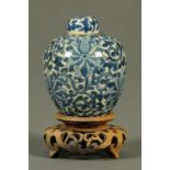 A miniature Chinese blue and white lidded jar, with six character mark to base and with wooden