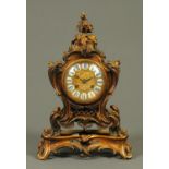 A 19th century French ormolu clock on integral stand, in the Rococo style,