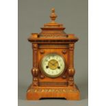 A Victorian walnut mantle clock,