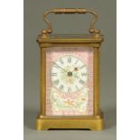 An Edwardian brass carriage clock, with Pompadour pink porcelain panels, timepiece only.  Height