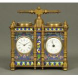 A brass desk timepiece and barometer, with Champleve type enamel decoration.  Width 128 mm.