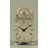 A silver cased timepiece, in the form of a lantern clock,