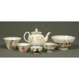 A Chinese polychrome teapot, three tea bowls and two larger bowls.  Teapot length 17 cm.