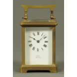 An Edwardian brass carriage clock, the case marked "E. Ewin, Dumfries, Made in Paris".